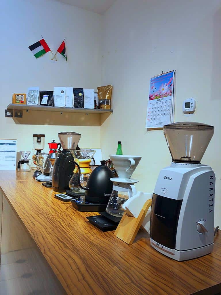 Manual brew bar with grinders, kettles and drippers at the Jex Institute campus in Deira